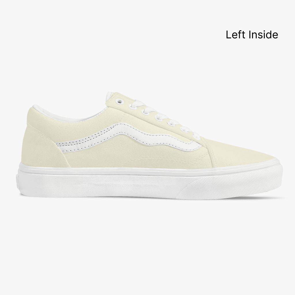 Pale yellow low-top canvas sneaker with white side stripe and white rubber sole.