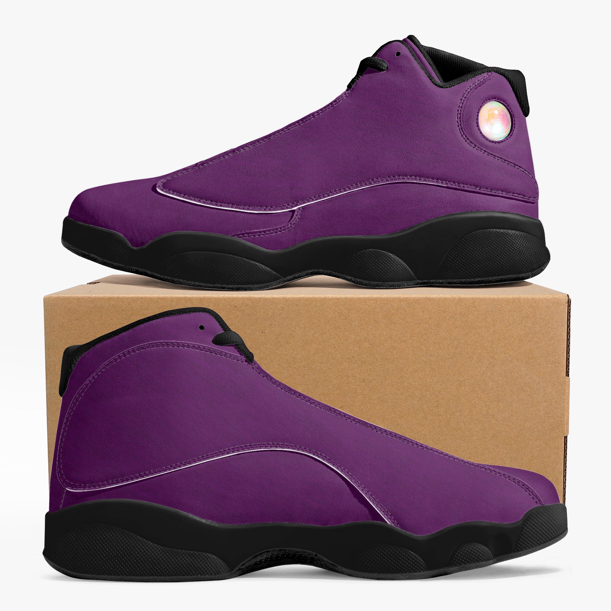 High-top purple leather basketball sneakers with black soles and subtle stitching details on a cardboard box.