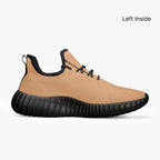 Beige mesh knit low-top sneaker with black ribbed sole and black laces.