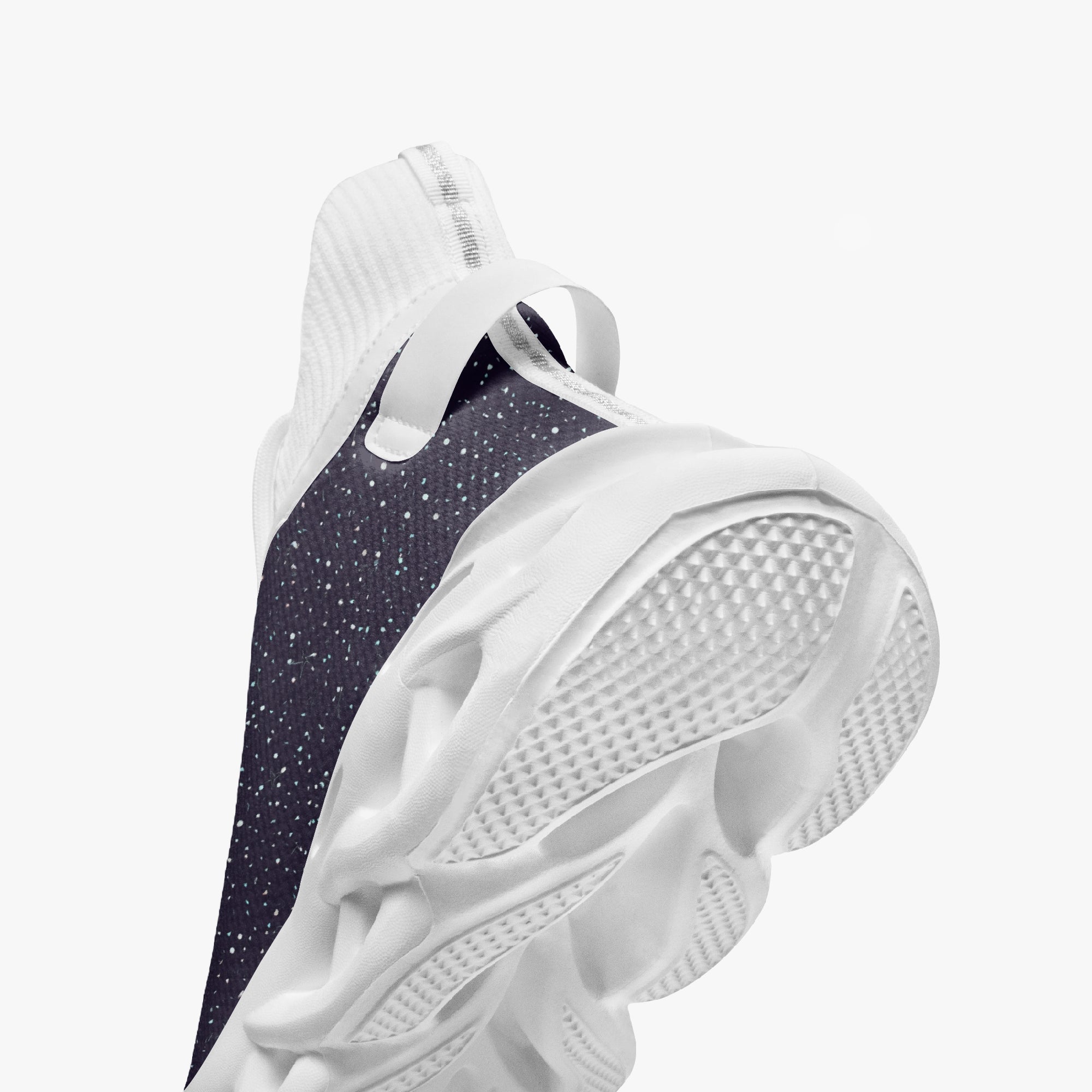 Black high-top sneakers with white speckled pattern and textured white sole.