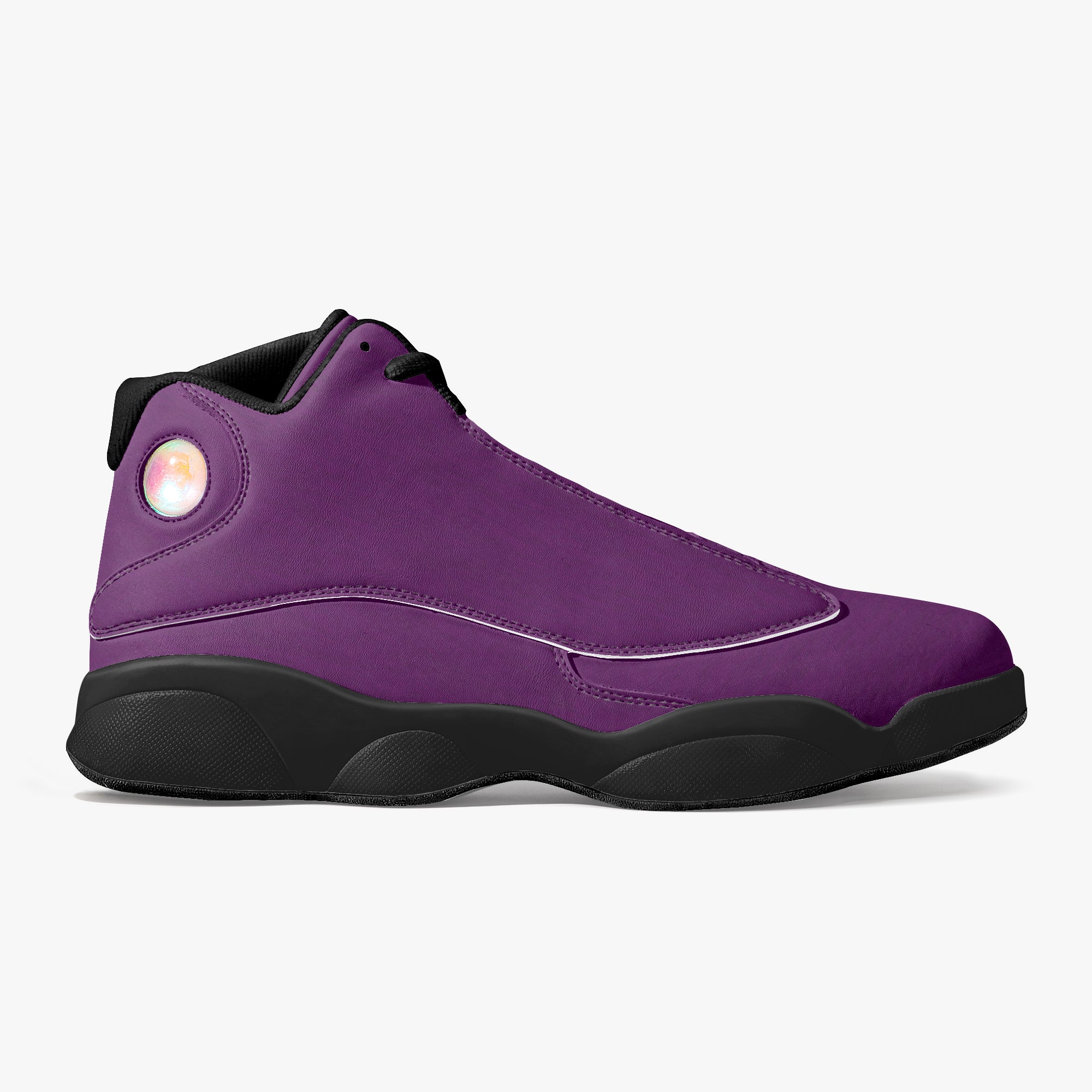 High-top purple leather basketball sneakers with black sole and iridescent circular logo on heel.
