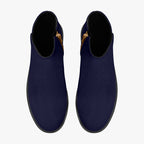 Navy blue slip-on booties with chunky black heels and red accent stitching on side zippers.
