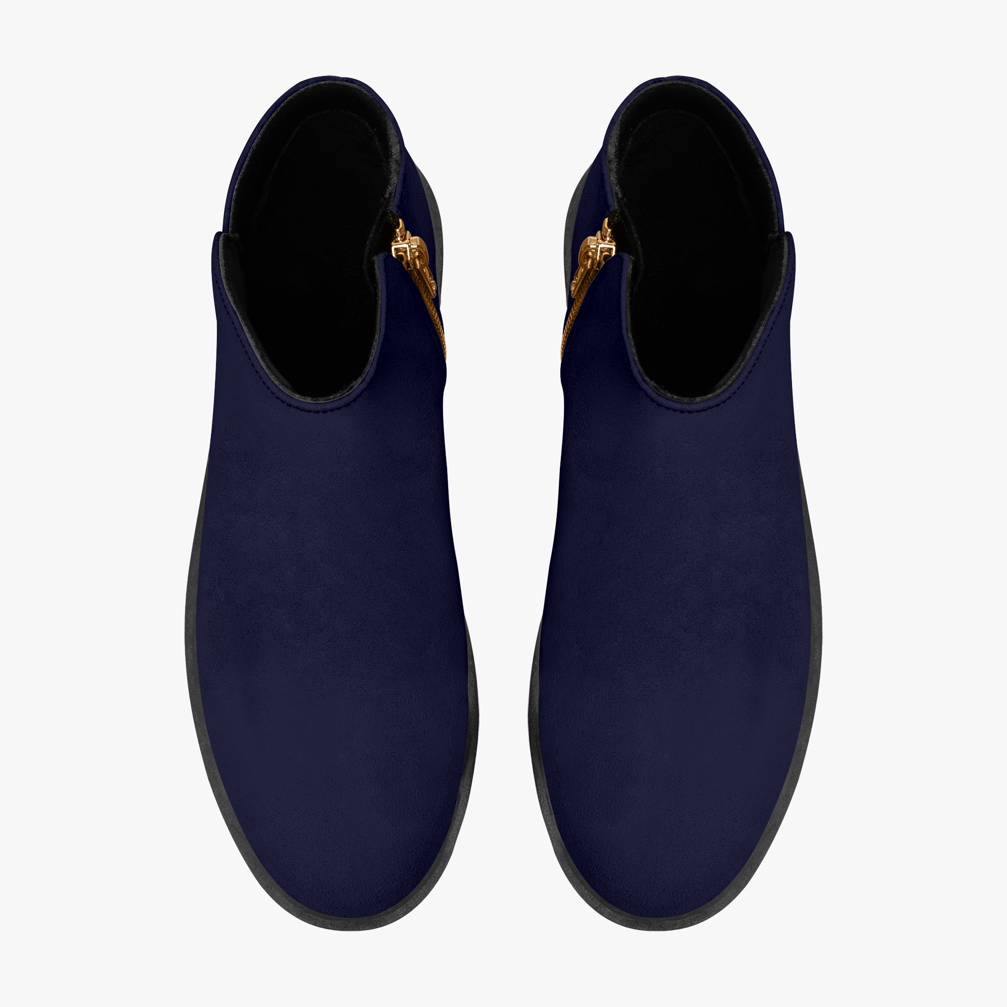 Navy blue slip-on booties with chunky black heels and red accent stitching on side zippers.