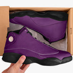 High-top purple leather basketball sneakers with black soles and iridescent circular logo in cardboard box.