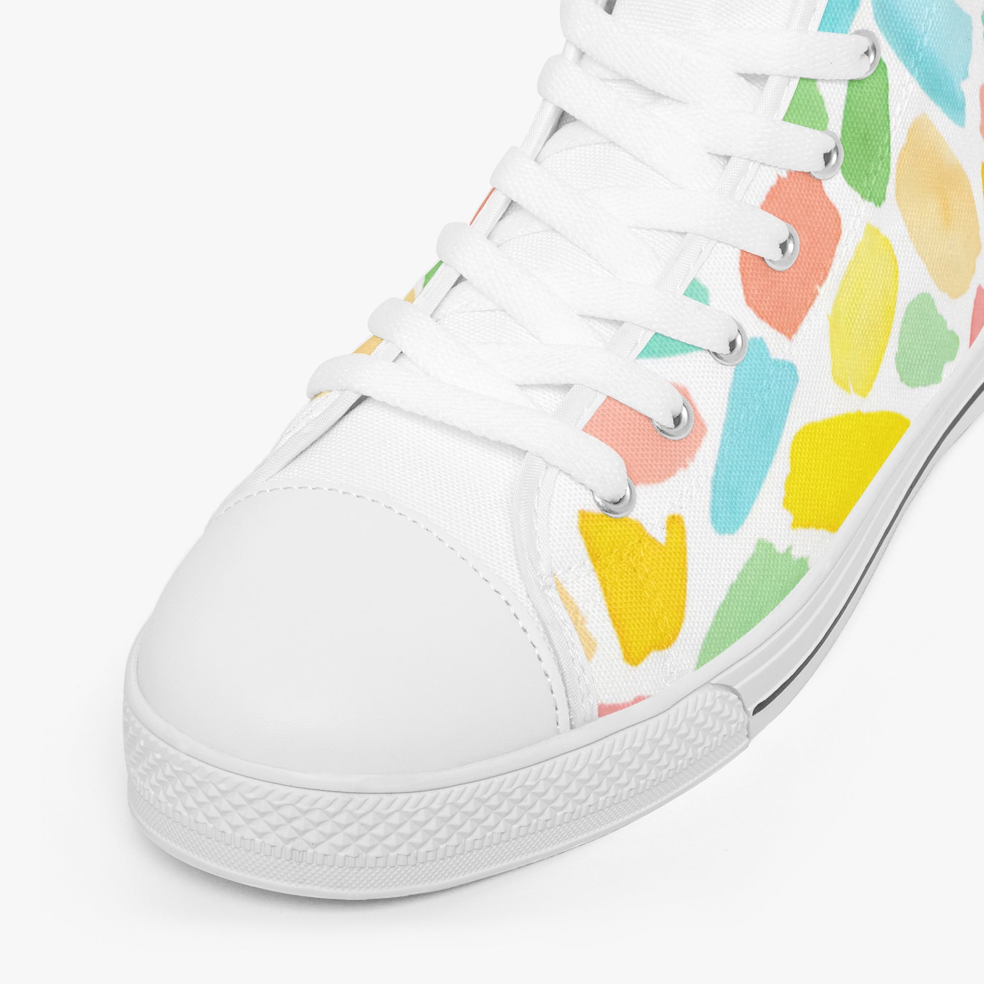 White high-top sneakers with colorful mosaic pattern in green, yellow, blue, and orange accents.