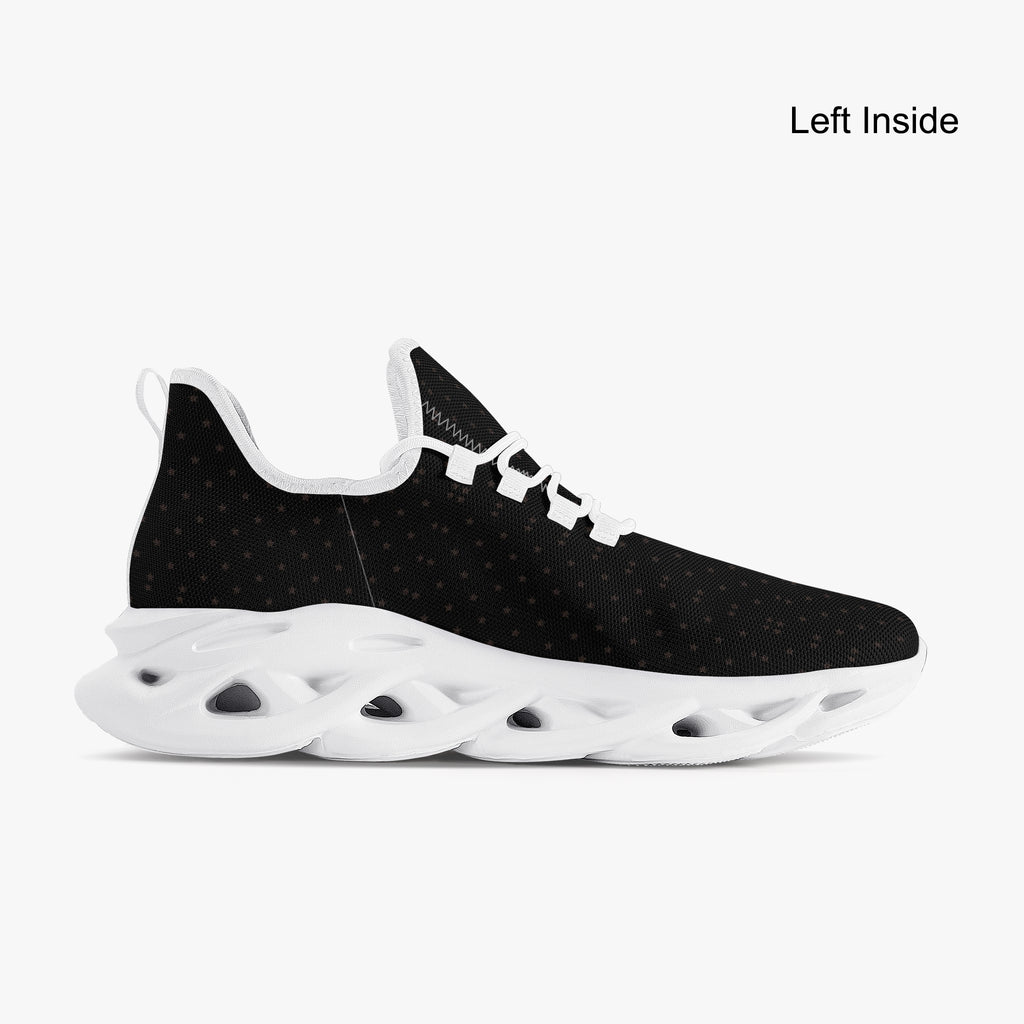 Black speckled knit sneaker with white scalloped sole and lace-up closure.