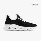 Black speckled knit sneaker with white scalloped sole and lace-up closure.