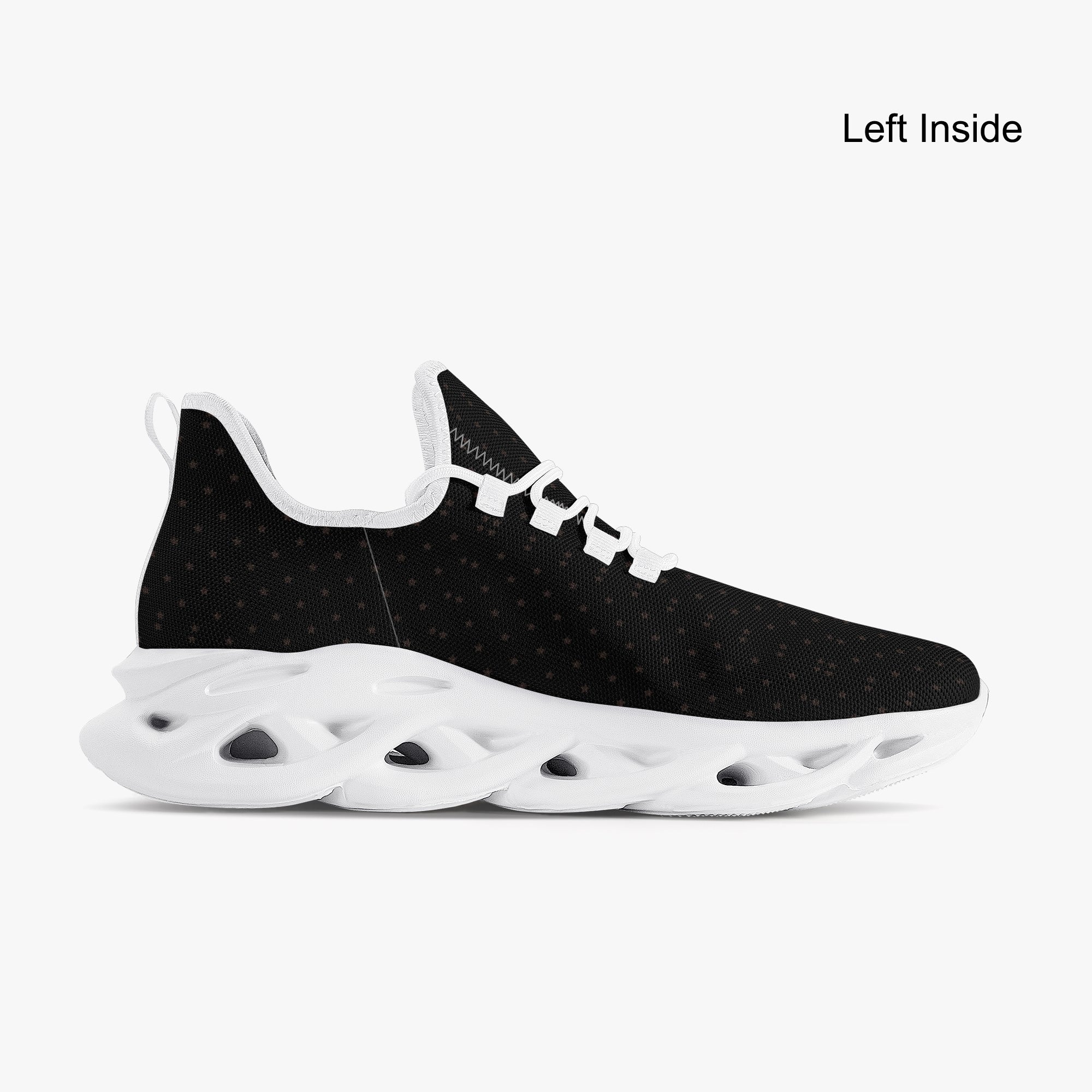 Black speckled knit sneaker with white scalloped sole and lace-up closure.