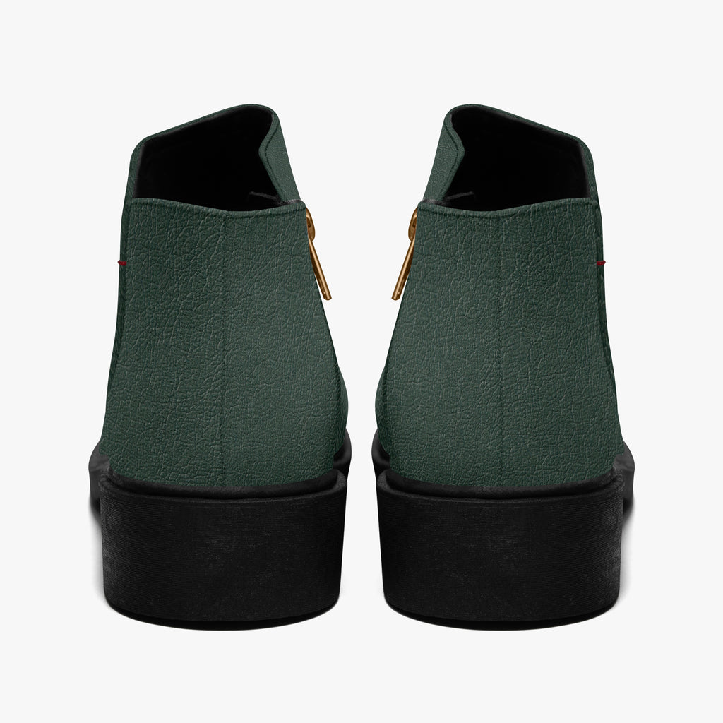 Dark green textured ankle boots with chunky black heels and gold side zippers, viewed from the back.