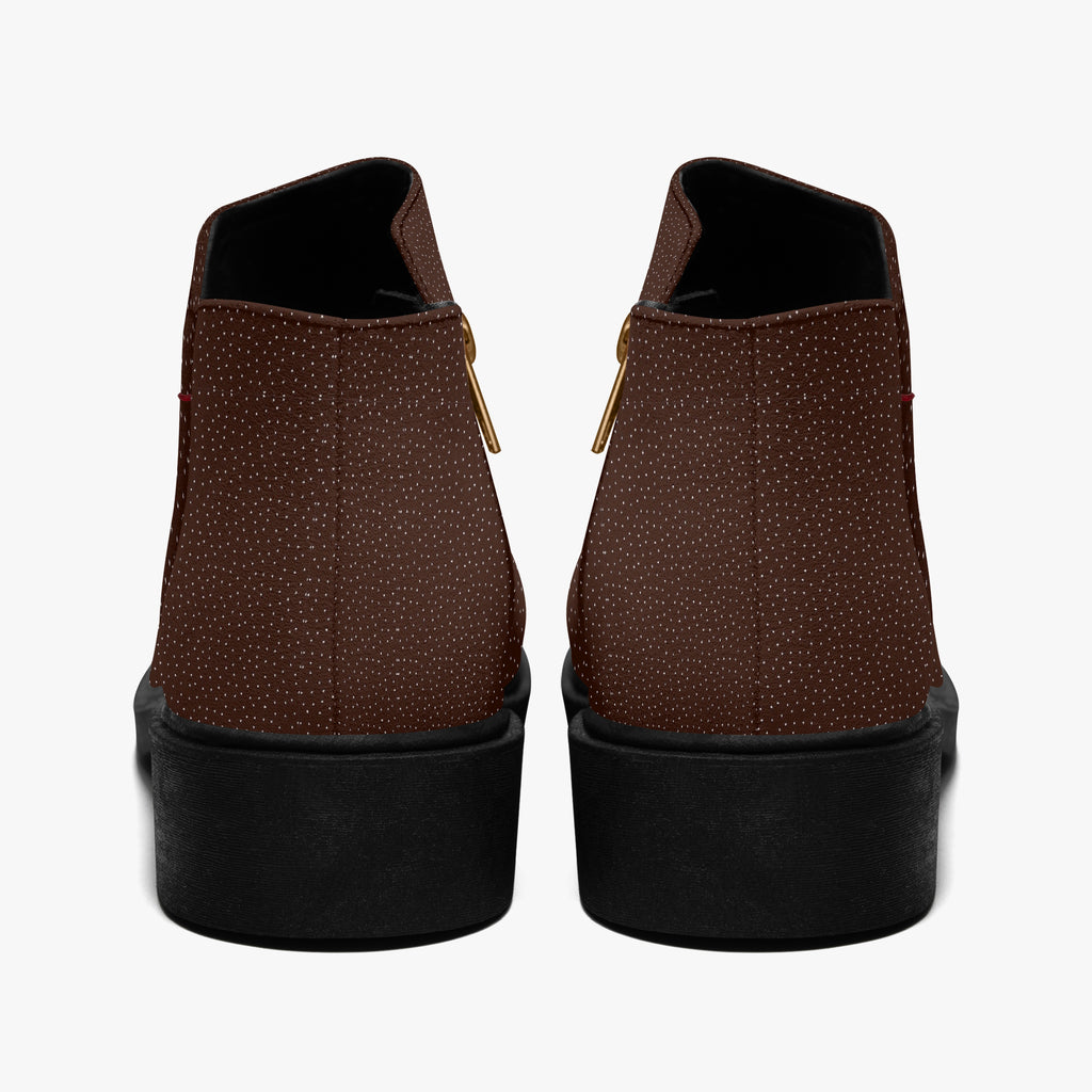 Chocolate brown ankle boots with micro-polka dot texture and chunky black heels, rear view.