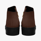 Chocolate brown ankle boots with micro-polka dot texture and chunky black heels, rear view.