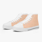 Peach and white high-top canvas sneakers with white laces and rubber soles.
