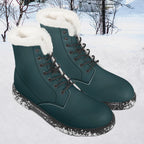 Midnight teal leather lace-up winter boots with plush white faux fur collar and snow-speckled soles.
