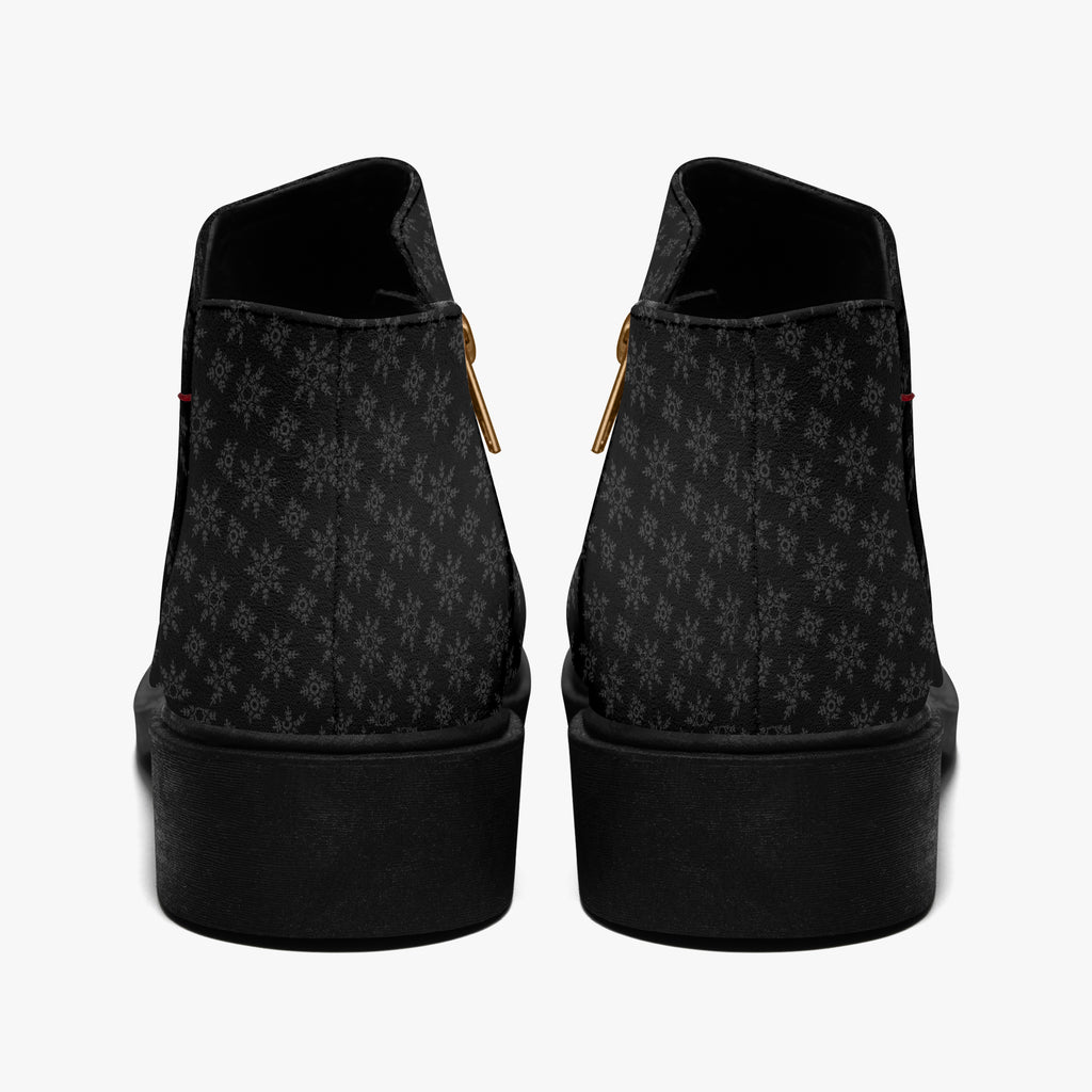 Black ankle boots with subtle gray snowflake print, chunky heel, and side zipper closure.