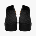 Black ankle boots with subtle gray snowflake print, chunky heel, and side zipper closure.