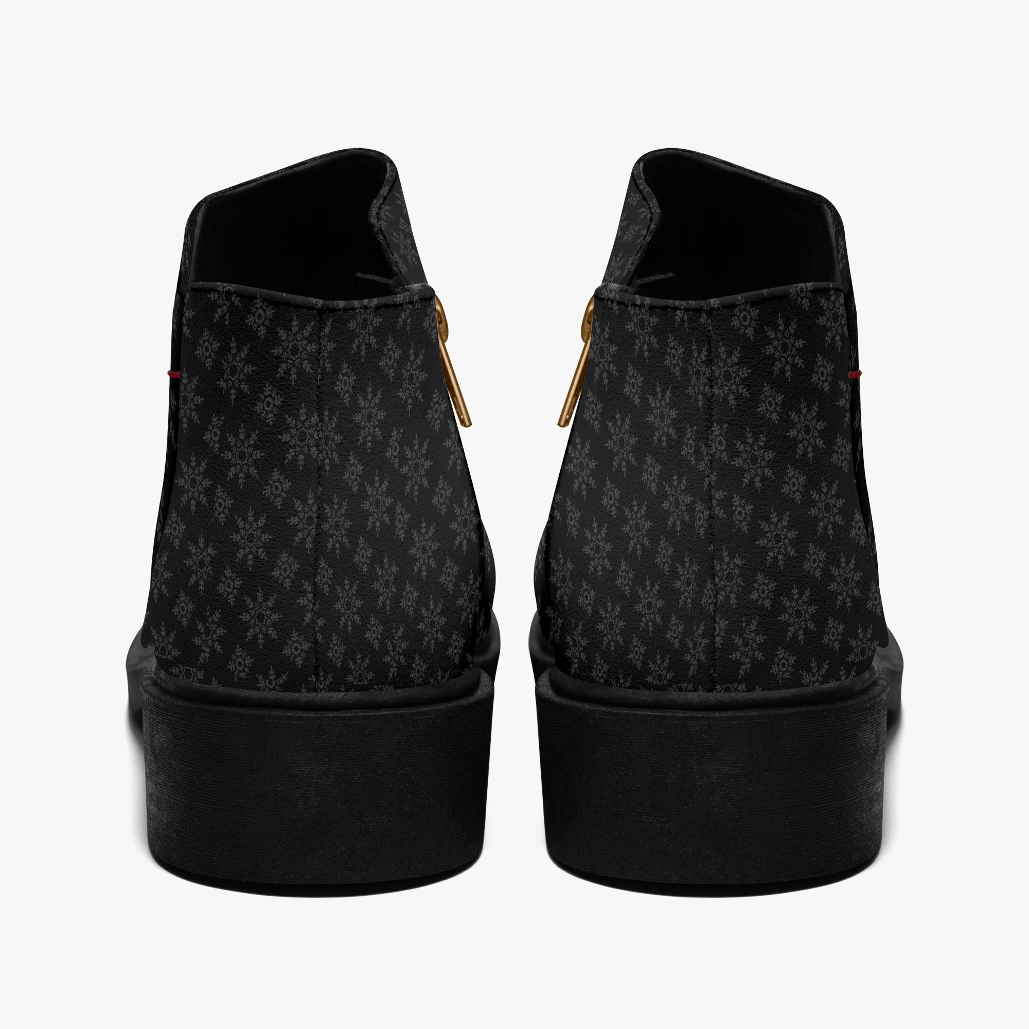Black ankle boots with subtle gray snowflake print, chunky heel, and side zipper closure.