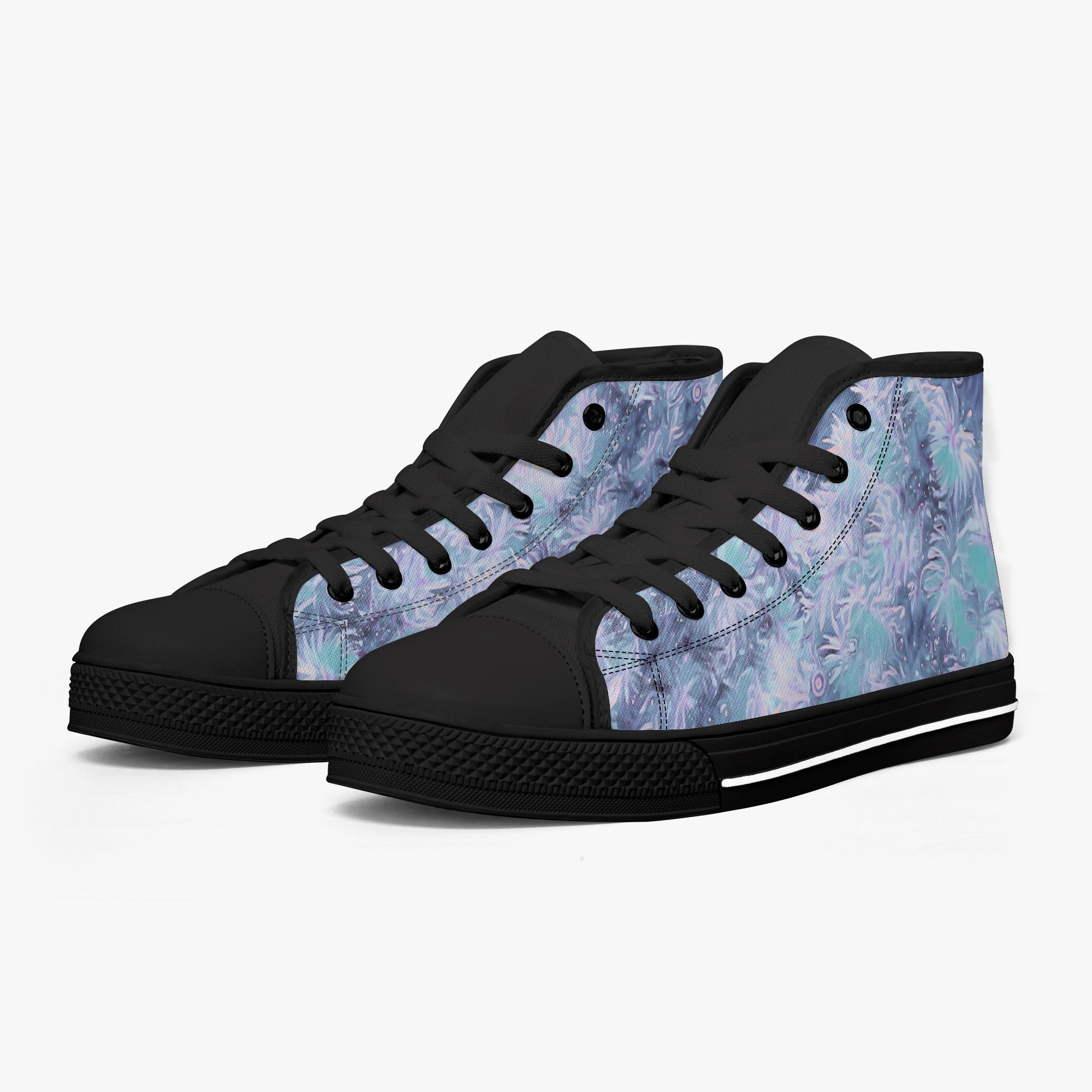 White and black high-top sneakers with blue floral pattern and black laces.