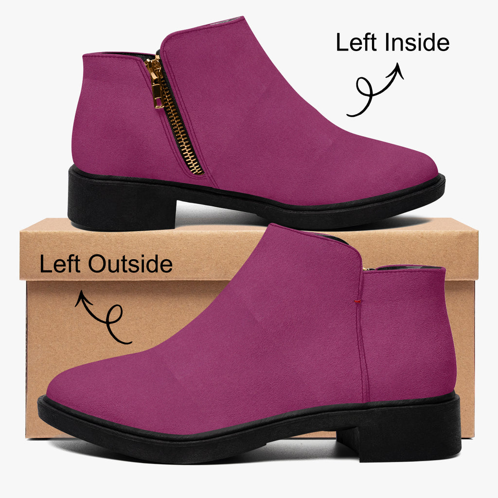 Magenta suede ankle boot with chunky black heel and gold side zipper on left foot.