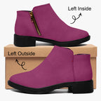 Magenta suede ankle boot with chunky black heel and gold side zipper on left foot.