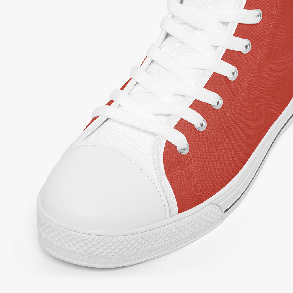 Bold red and white high-top canvas sneakers with white laces and textured rubber sole.