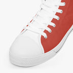 Bold red and white high-top canvas sneakers with white laces and textured rubber sole.