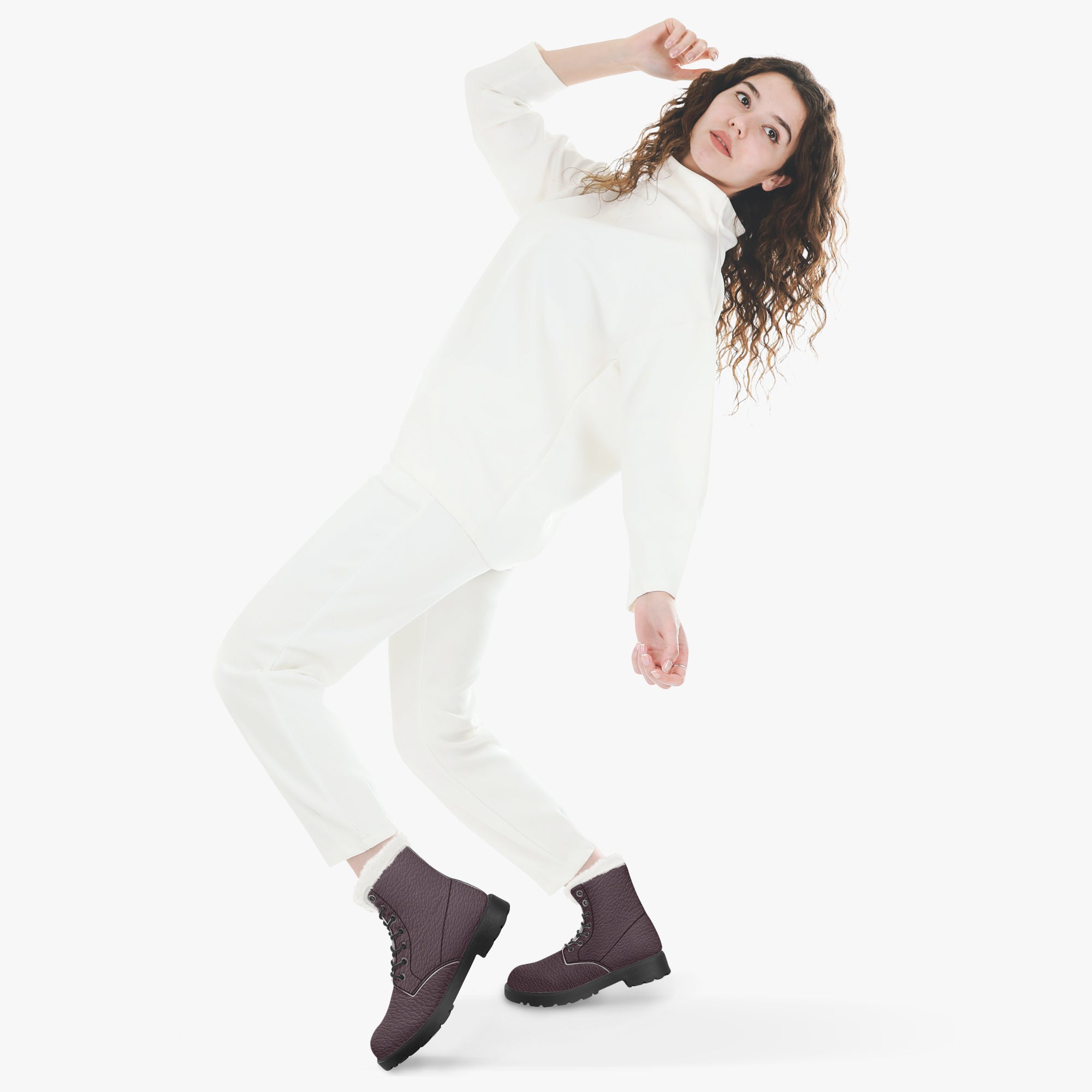 Plum pebbled leather lace-up winter boots with white faux fur collar worn with white outfit.