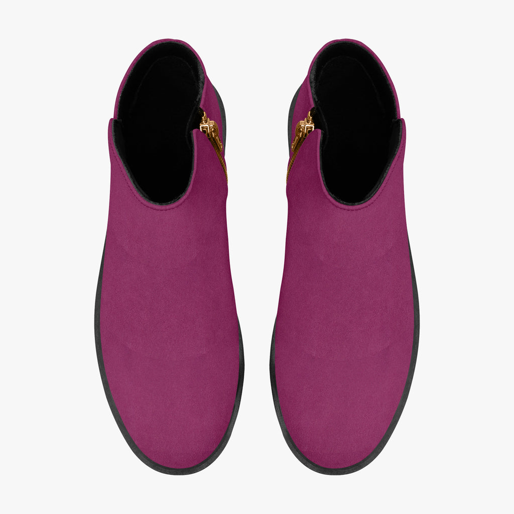 Magenta suede ankle boots with rounded toes and black chunky heels viewed from above.