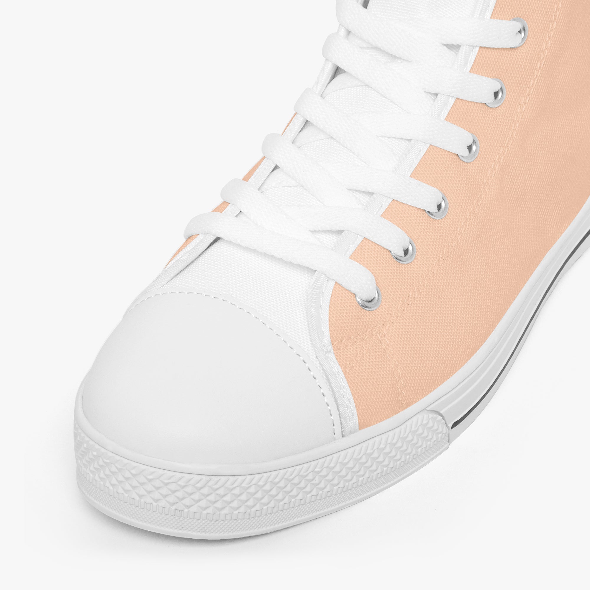 White and peach high-top canvas sneakers with white laces and rubber sole.