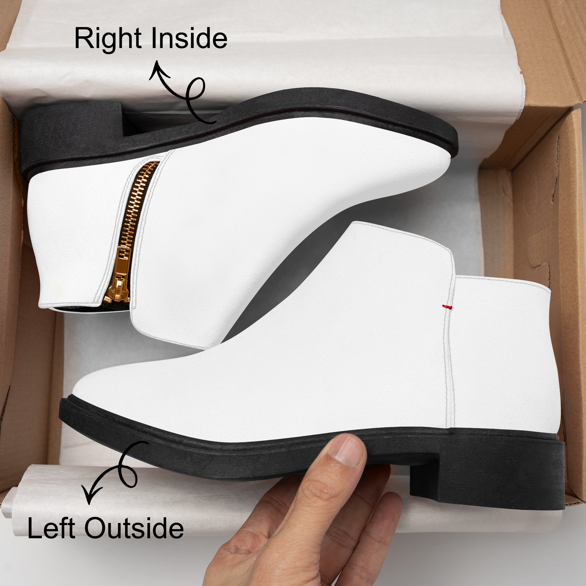 White slip-on ankle booties with chunky black heels, red accent stitching, and side zipper detail.