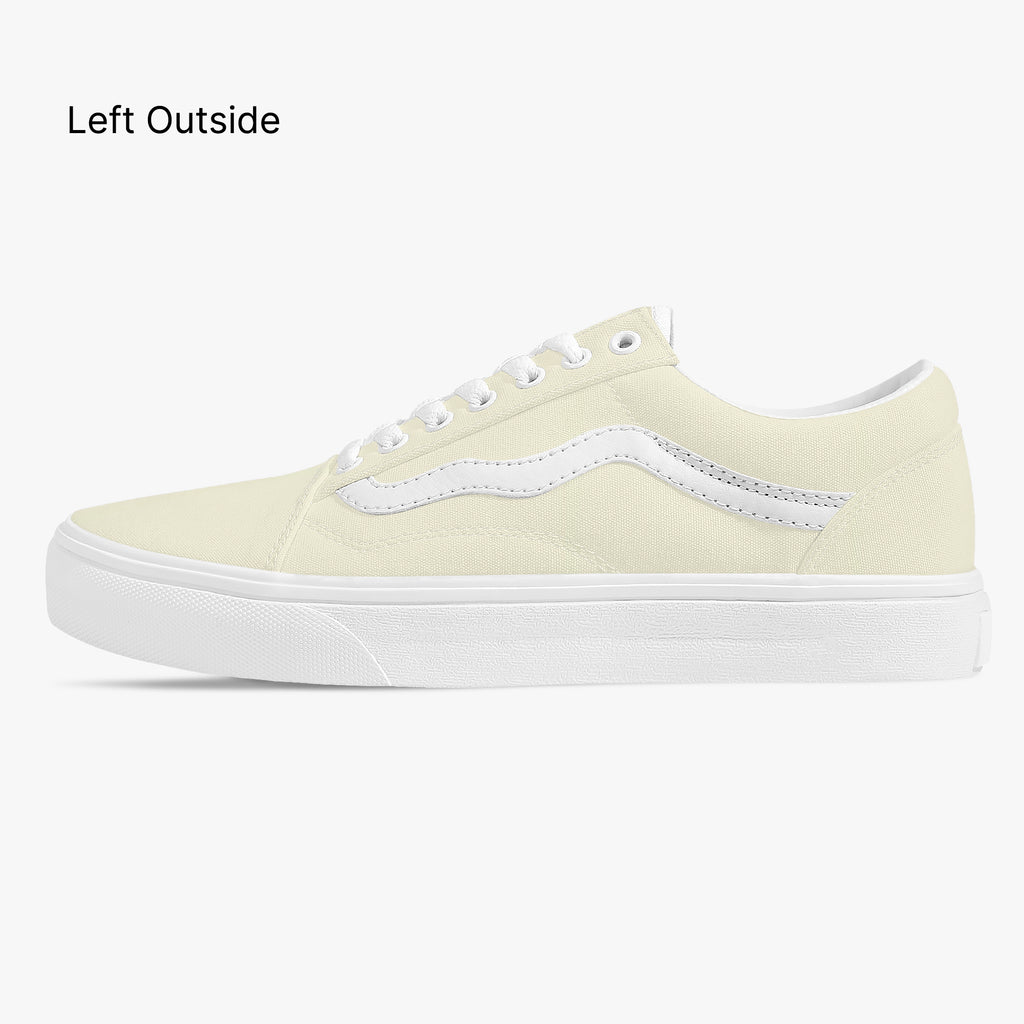 Pale yellow low-top canvas sneaker with white side stripe and white rubber sole.