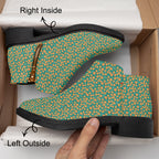 Teal ankle boots with orange floral print, chunky black heels, and fashion zipper sides.