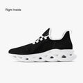 Black speckled knit sneaker with white cushioned sole and breathable mesh upper.