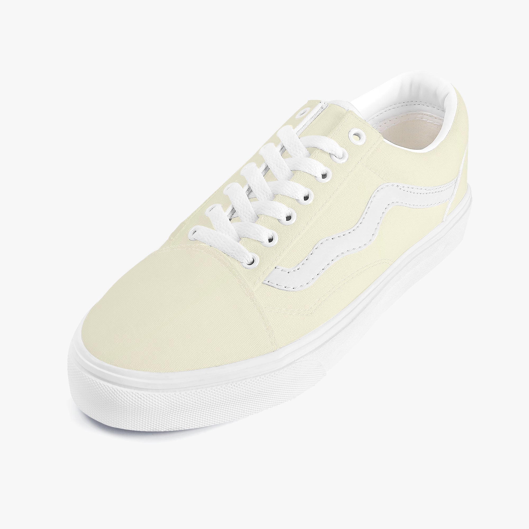 Pale yellow low-top canvas sneaker with white laces and contrasting white side stripe on white rubber sole.