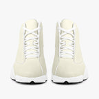 Cream and white high-top leather basketball sneakers with white laces and thick white soles.