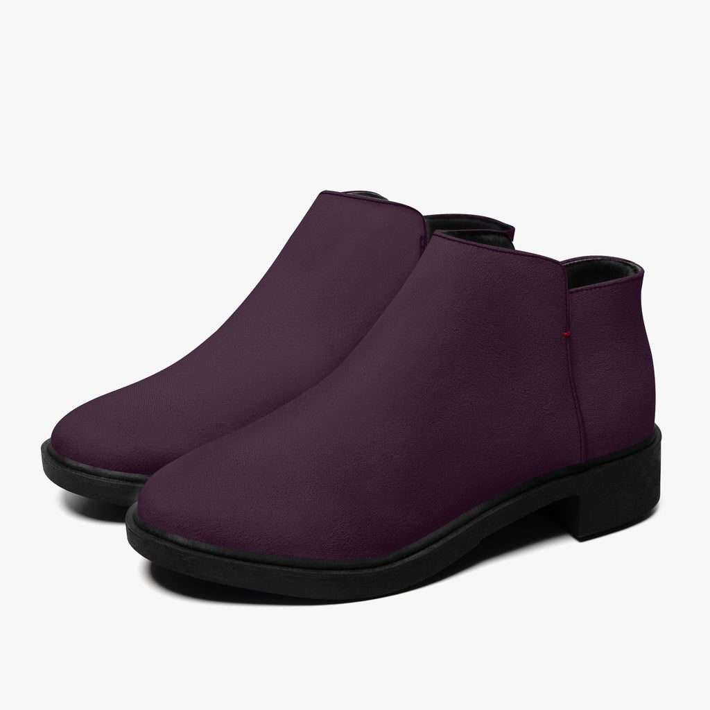 Deep plum slip-on ankle booties with smooth finish, chunky black heels, and subtle red stitch accent.