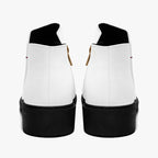 Pair of modern white slip-on booties with chunky black heels and red accent stitching viewed from the back.