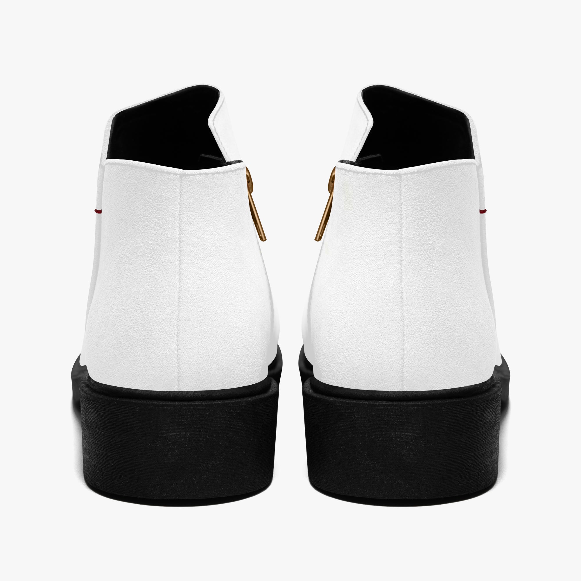 Pair of modern white slip-on booties with chunky black heels and red accent stitching viewed from the back.