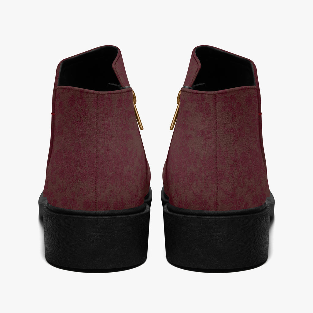 Burgundy floral lace slip-on booties with chunky black heels and gold side zippers, rear view.