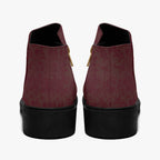 Burgundy floral lace slip-on booties with chunky black heels and gold side zippers, rear view.