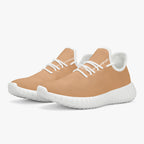 Beige mesh knit low-top sneakers with white laces and textured white sole.