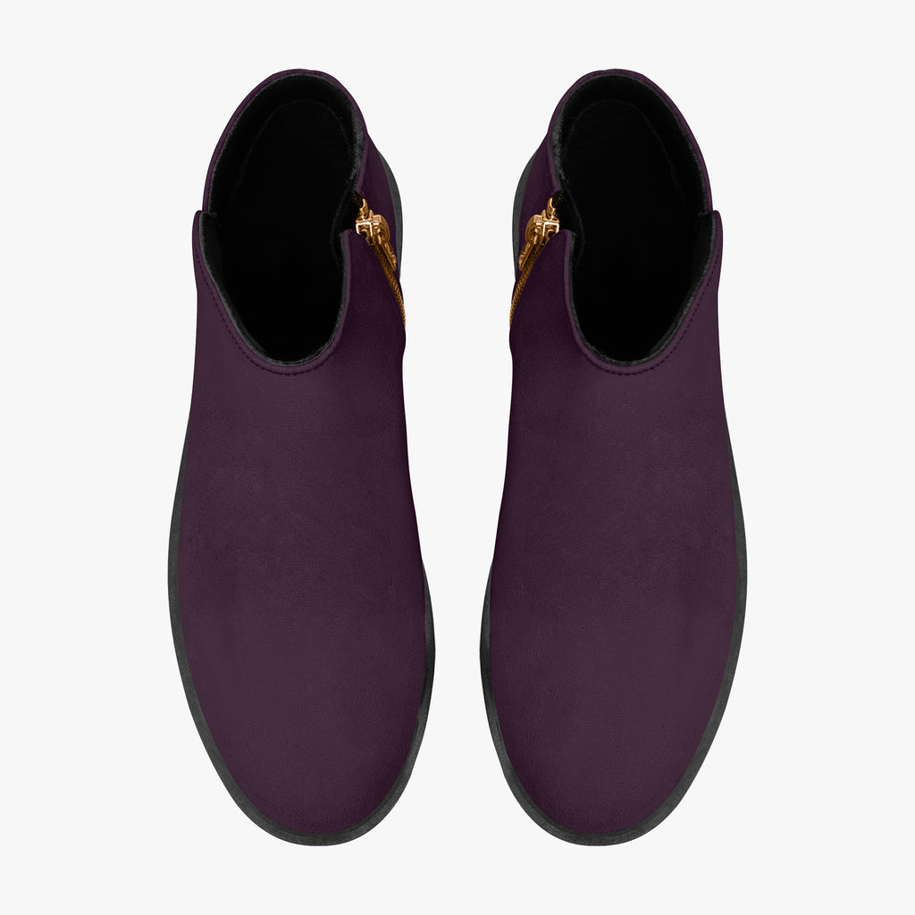 Deep plum slip-on booties with smooth matte finish and chunky black heels, gold side zippers visible.