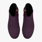 Deep plum slip-on booties with smooth matte finish and chunky black heels, gold side zippers visible.