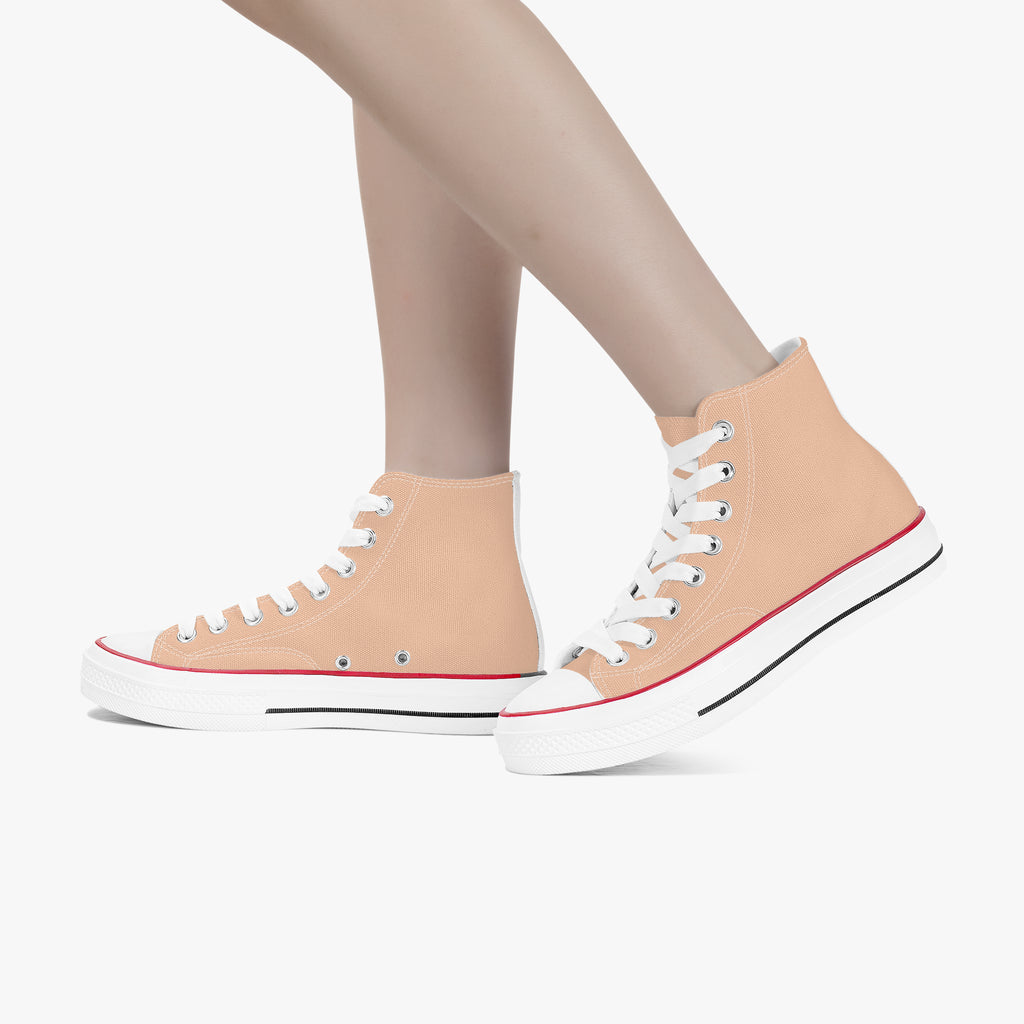 Peach high-top canvas sneakers with white laces and red trim on white rubber sole.