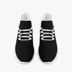 Black speckled knit sneakers with white laces and white rubber soles, viewed from above.