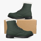 Forest green leather lace-up boots with plush white faux fur collar and black sole displayed on and beside a cardboard box.