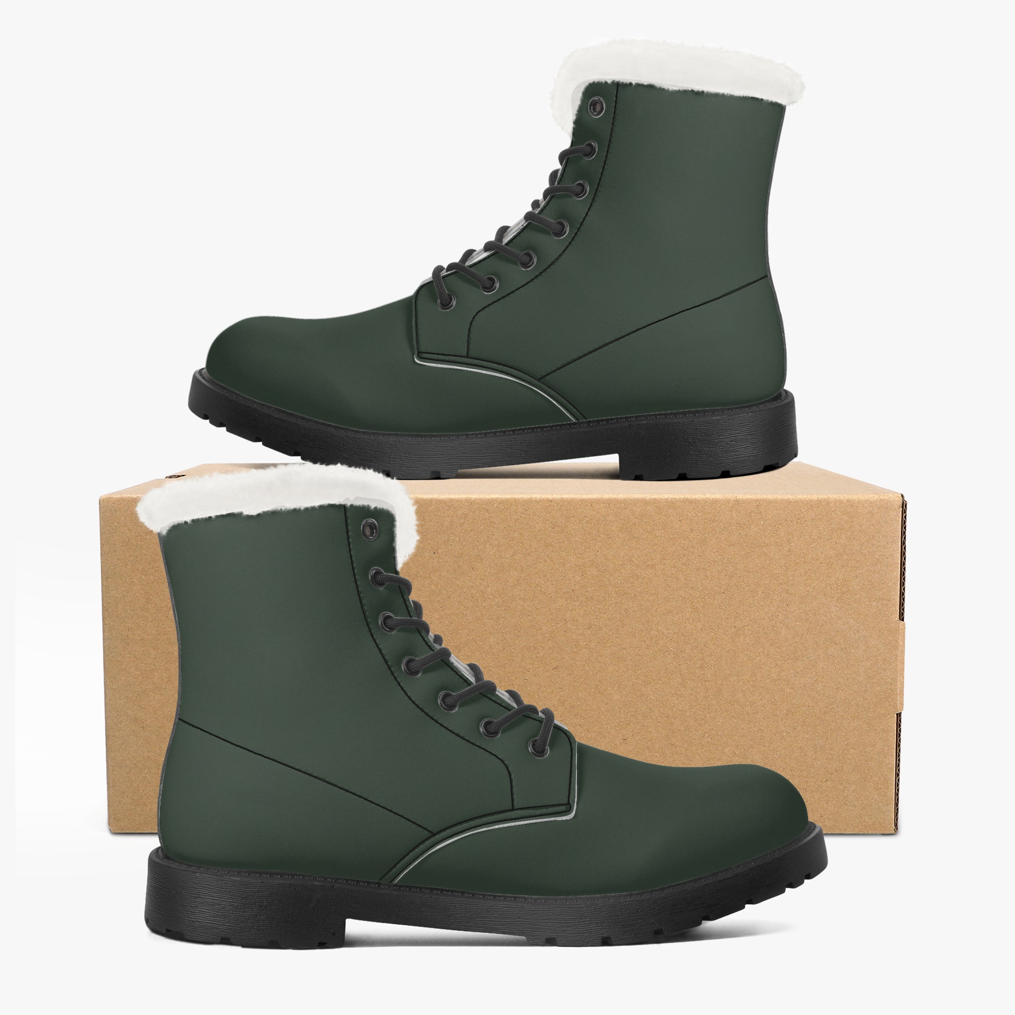 Forest green leather lace-up boots with plush white faux fur collar and black sole displayed on and beside a cardboard box.