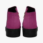 Magenta suede ankle boots with chunky black heels and gold zipper pull tabs, rear view.