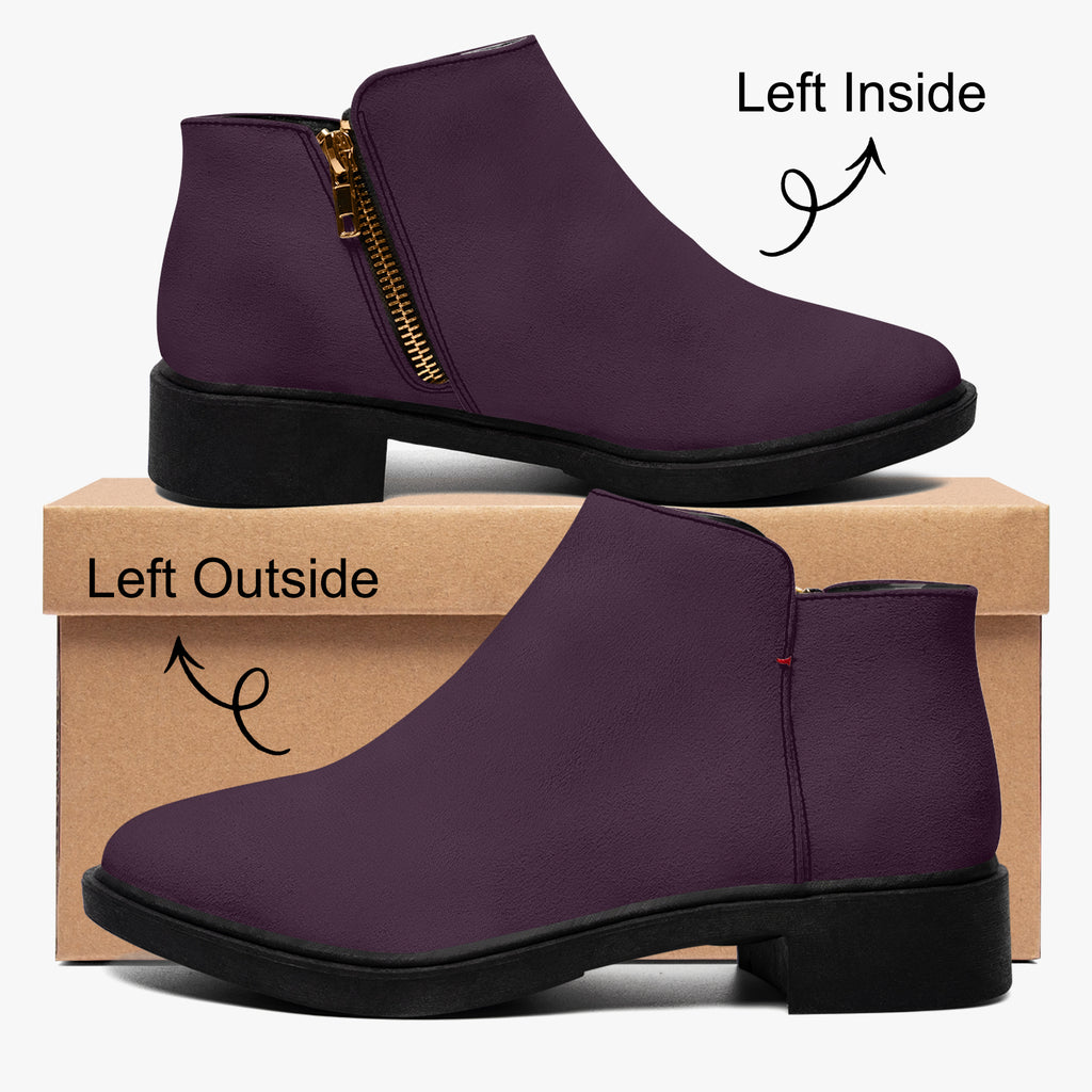Deep plum slip-on bootie with chunky black heel, gold zipper, and subtle red accent stitch.