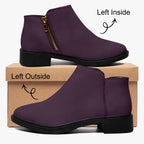 Deep plum slip-on bootie with chunky black heel, gold zipper, and subtle red accent stitch.