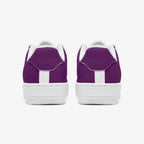 Pair of classic purple low-top leather sneakers with white soles and heel accents, viewed from the back.